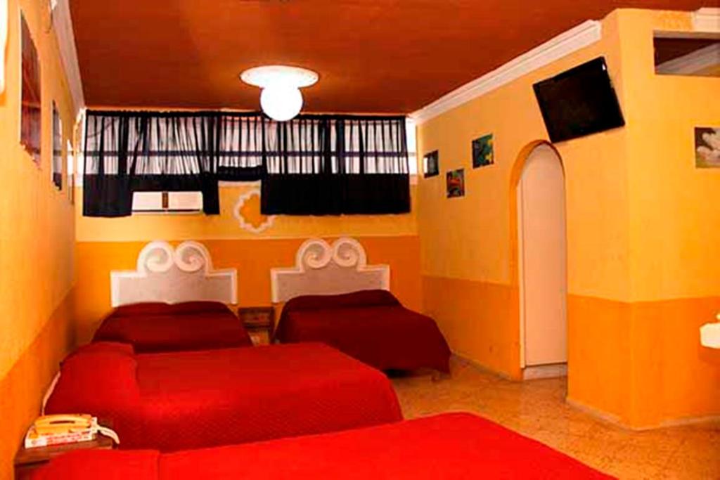 TV a/nebo společenská místnost v ubytování Hotel Suites Elia Noemi