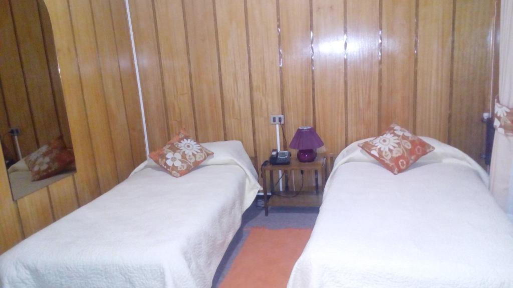 Postel nebo postele na pokoji v ubytování Hotel Le Mirage