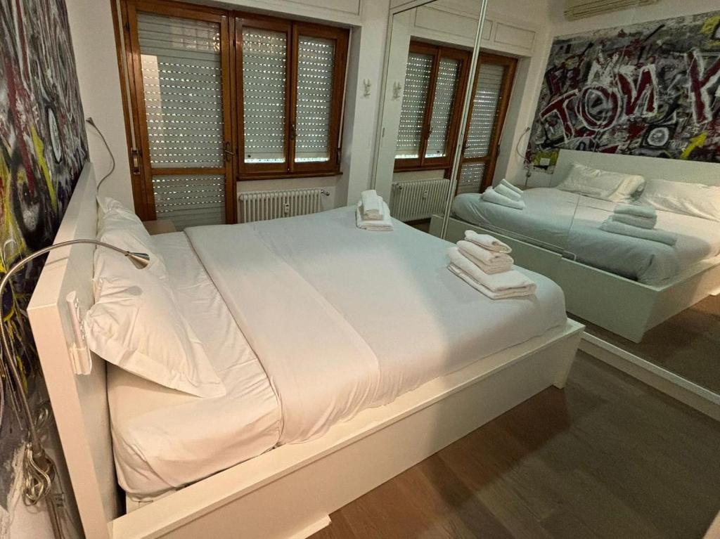 Ένα ή περισσότερα κρεβάτια σε δωμάτιο στο Foscari Cozy House