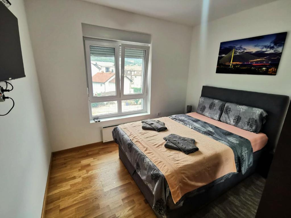 Ένα ή περισσότερα κρεβάτια σε δωμάτιο στο Trajkovic One Bedroom Apartment