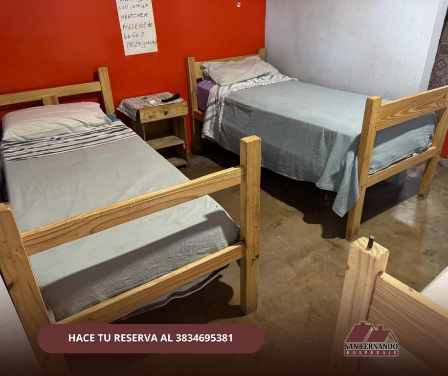 Ένα ή περισσότερα κρεβάτια σε δωμάτιο στο hospedaje san fernando