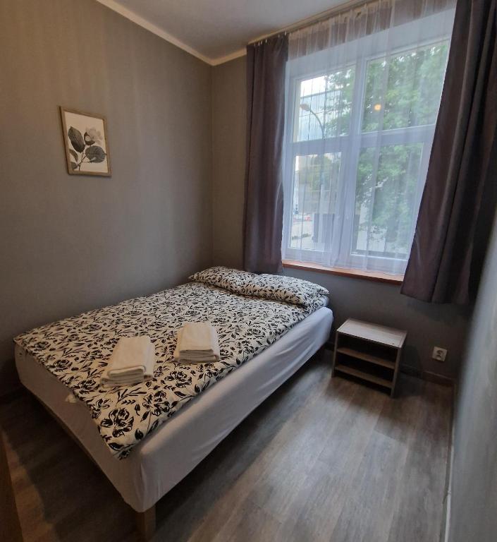 Postel nebo postele na pokoji v ubytování Apartament Anna
