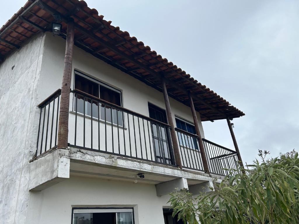 a balcony on the side of a house at Casa em Lavras Novas - 2 Suítes casal - AP02 in Ouro Preto