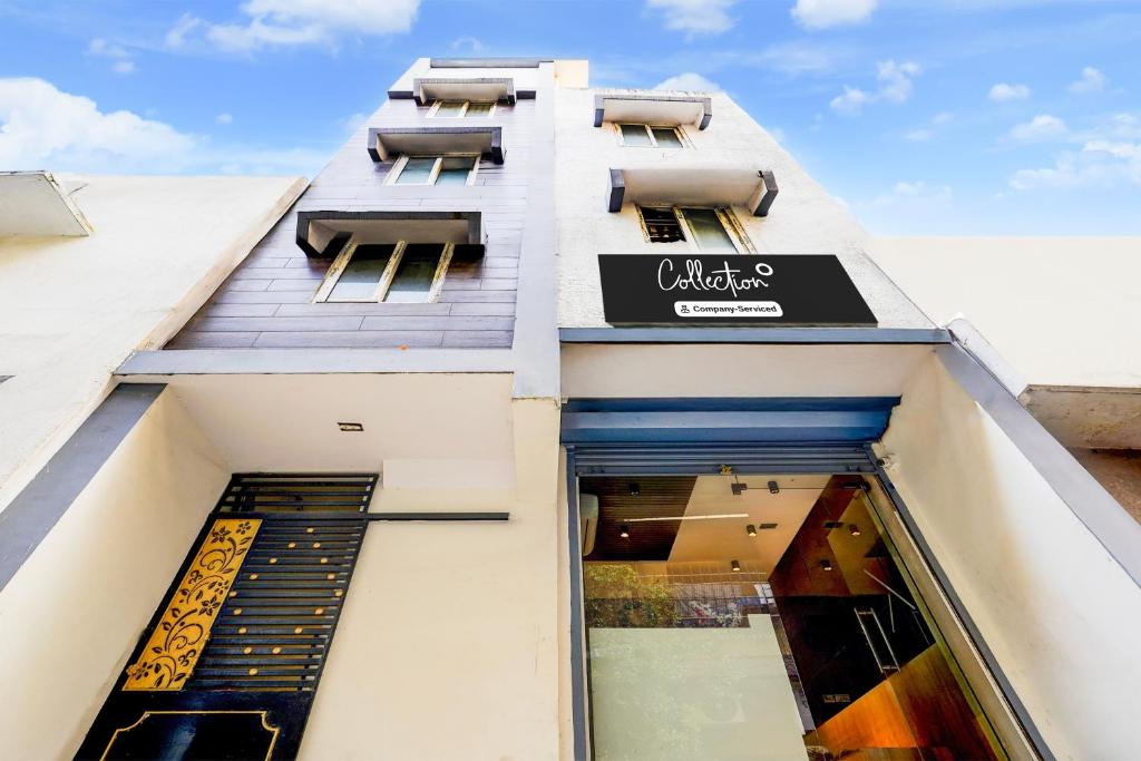 a building with a sign on the side of it at Collection O Thousand Lights Chennai in Chennai