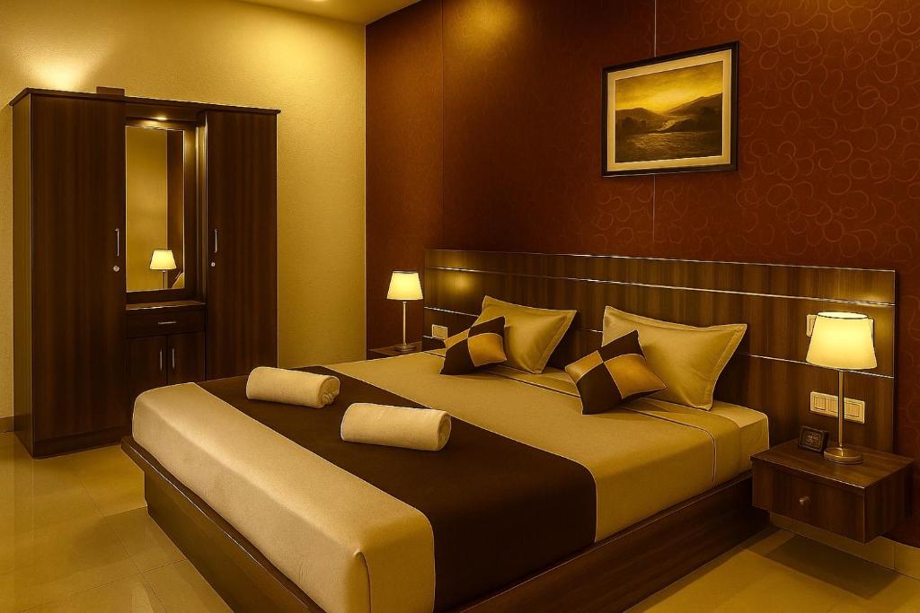 a bedroom with a large bed with pillows at Hill side Home in Anachal