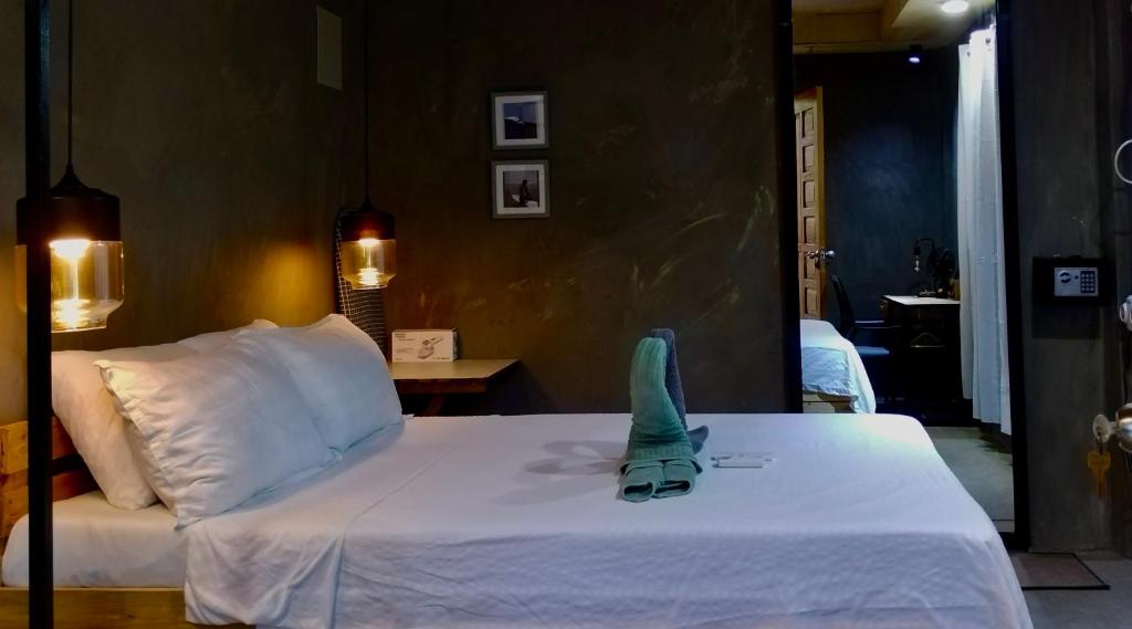 a bedroom with a bed with a toy on it at SUMMER HOUSE B Starlink in General Luna