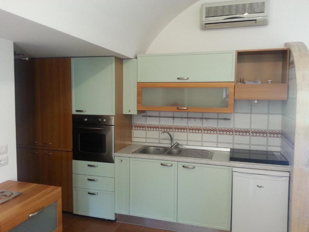 Кухня или мини-кухня в Casa Vacanze Bouganvillea
