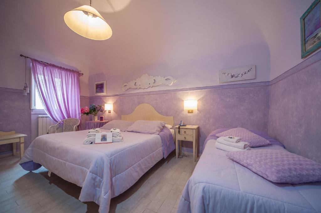 Postel nebo postele na pokoji v ubytování Albergo Etruria