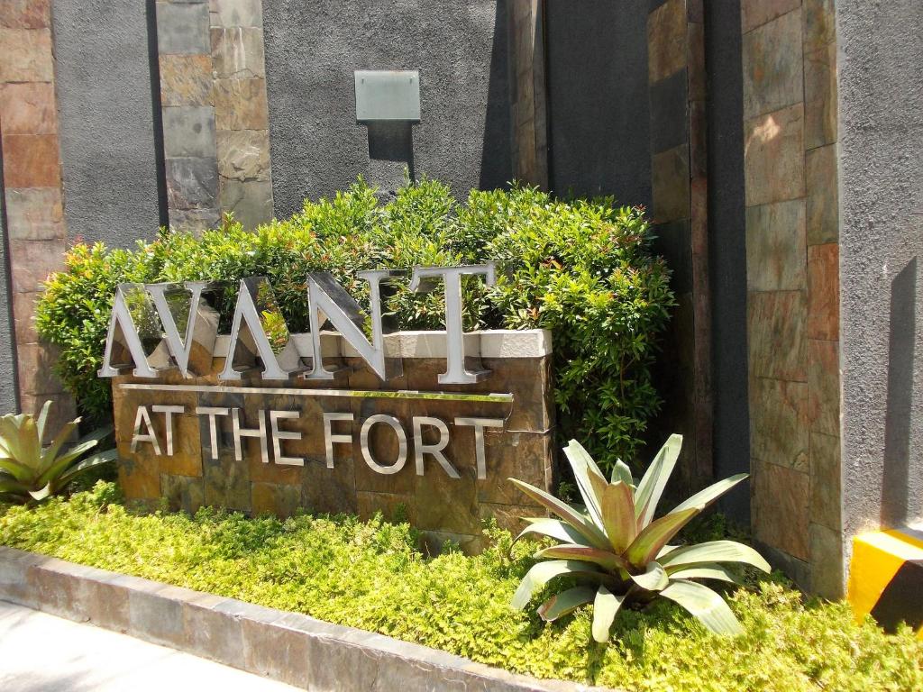 a sign for a mall at the front of a building at Avant Serviced Suites - Personal Concierge in Manila