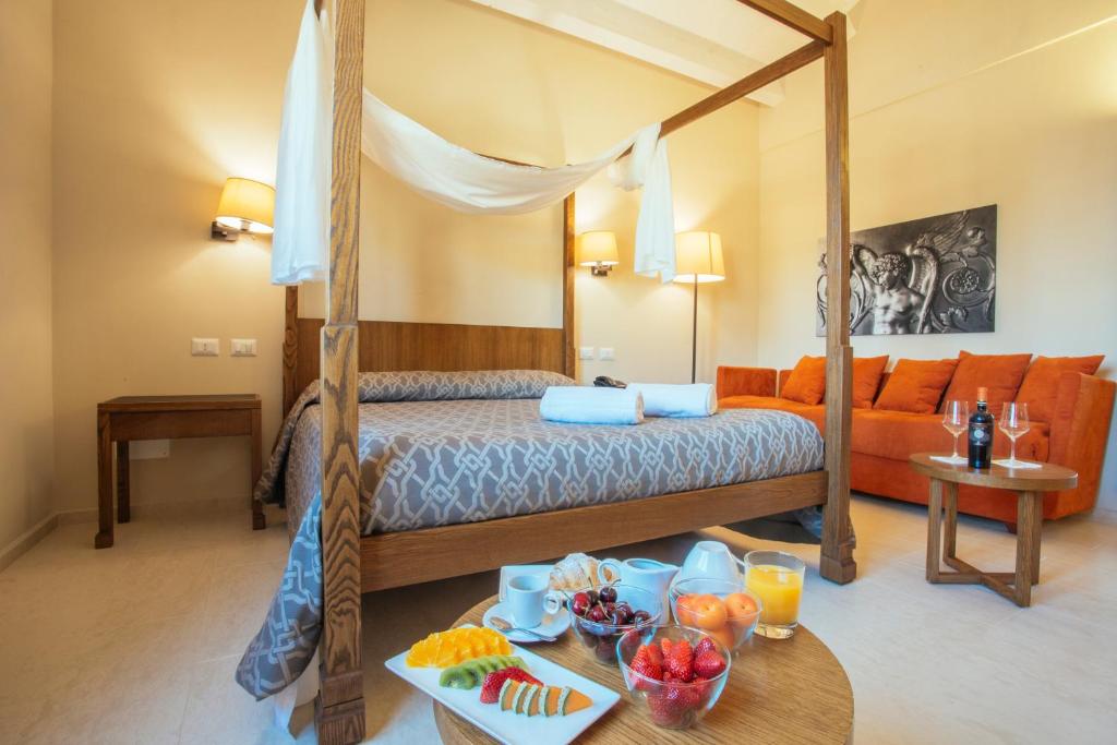 Postel nebo postele na pokoji v ubytování Firriato Hospitality - Baglio Sorìa
