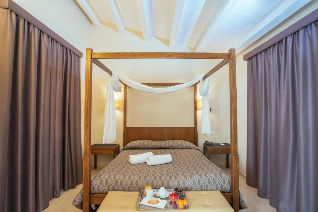 Postel nebo postele na pokoji v ubytování Firriato Hospitality - Baglio Sorìa