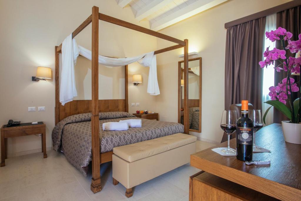 Postel nebo postele na pokoji v ubytování Firriato Hospitality - Baglio Sorìa