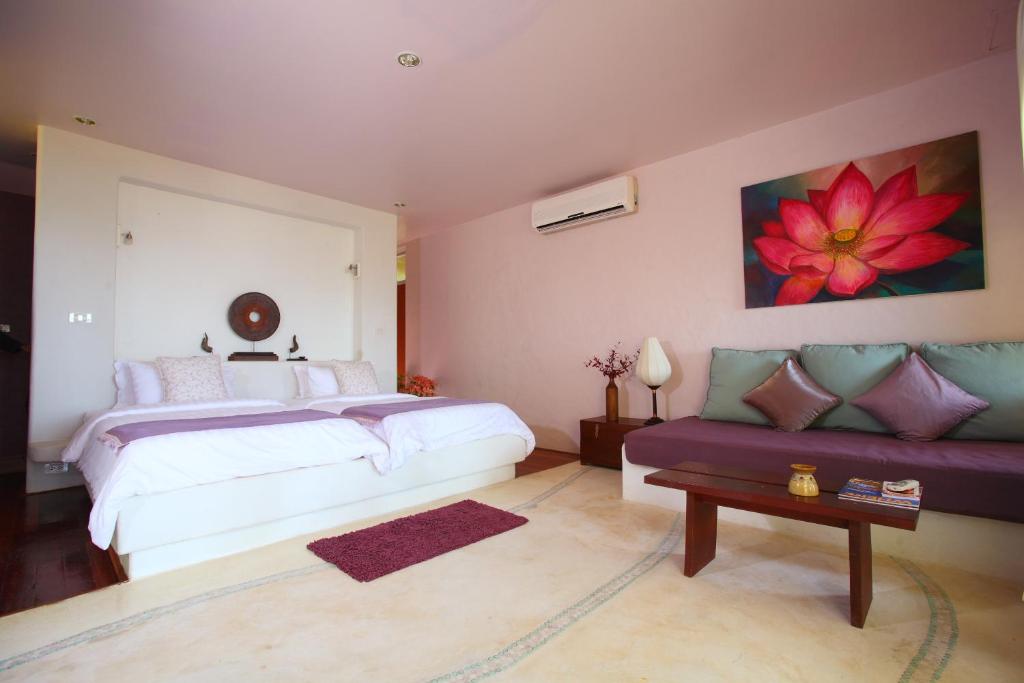 Postel nebo postele na pokoji v ubytování Vacation Village Phra Nang Lanta - SHA Extra Plus