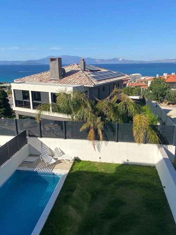 a view of a house with a swimming pool at Kaptan Villas in Çeşme