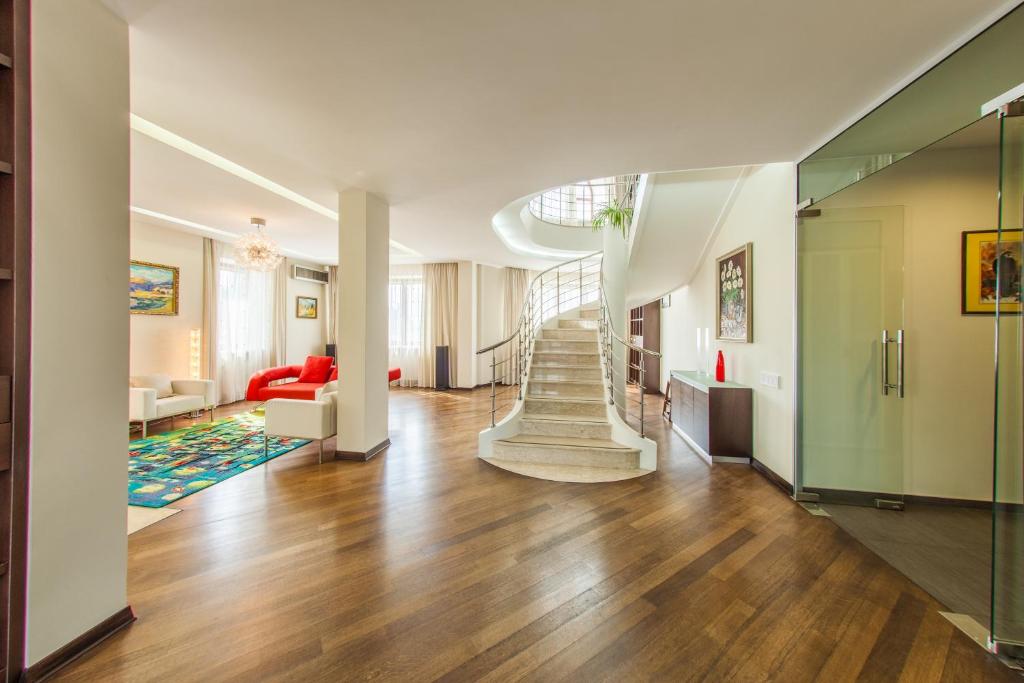 a hallway with a staircase in a house at Zhilyanskaya 30а apartments in Kyiv