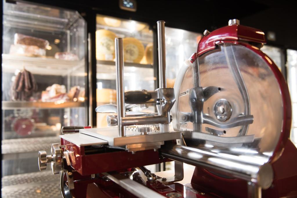 a red machine is in front of a bakery at Octant Ponta Delgada in Ponta Delgada