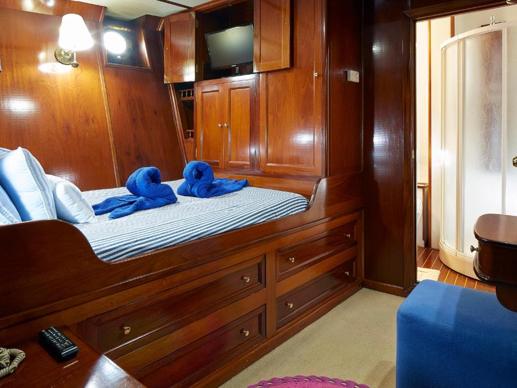 two stuffed animals sitting on a bed in a boat at Southern Cross in Barcelona