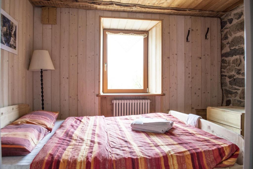 Postel nebo postele na pokoji v ubytování Rifugio Serot