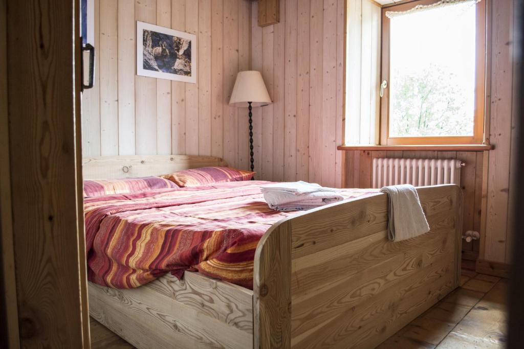 Postel nebo postele na pokoji v ubytování Rifugio Serot