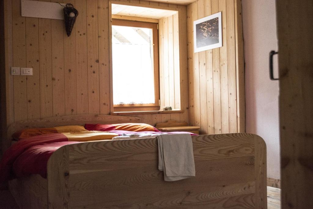 Postel nebo postele na pokoji v ubytování Rifugio Serot