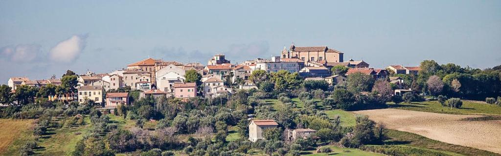 a group of houses on top of a hill at Happy House Montemarciano in Montemarciano