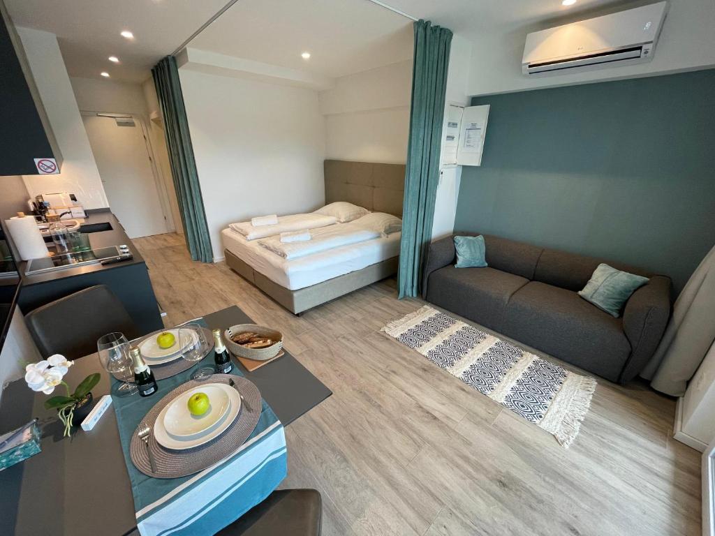 a small room with a bed and a table at Stunning Wörthersee -Double Units in Sekull