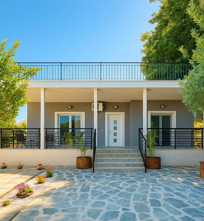 a house with a staircase and a balcony at House 2BD Private Parking Next to Center in Asprovalta