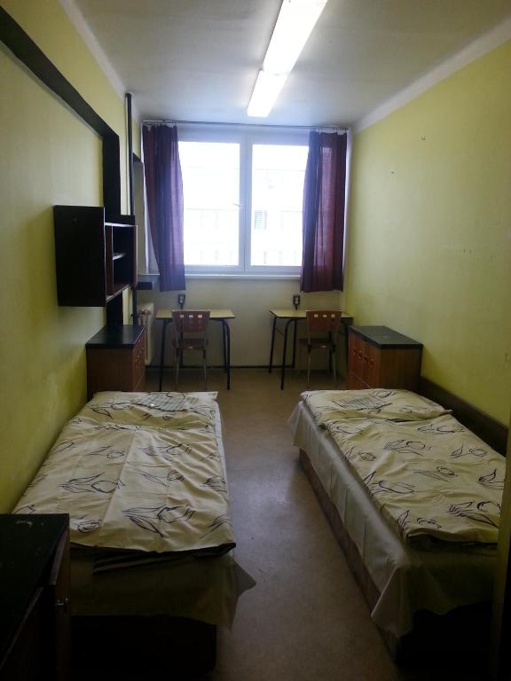 Voodi või voodid majutusasutuse Hostel Strahov toas