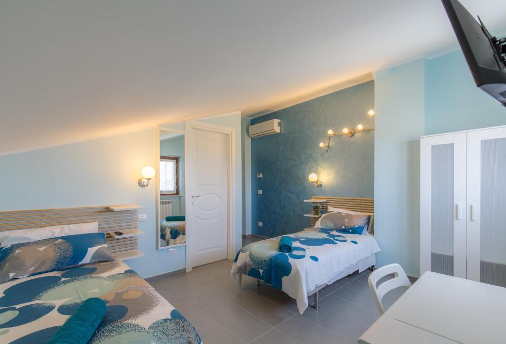 Postel nebo postele na pokoji v ubytování BellaVista B&B
