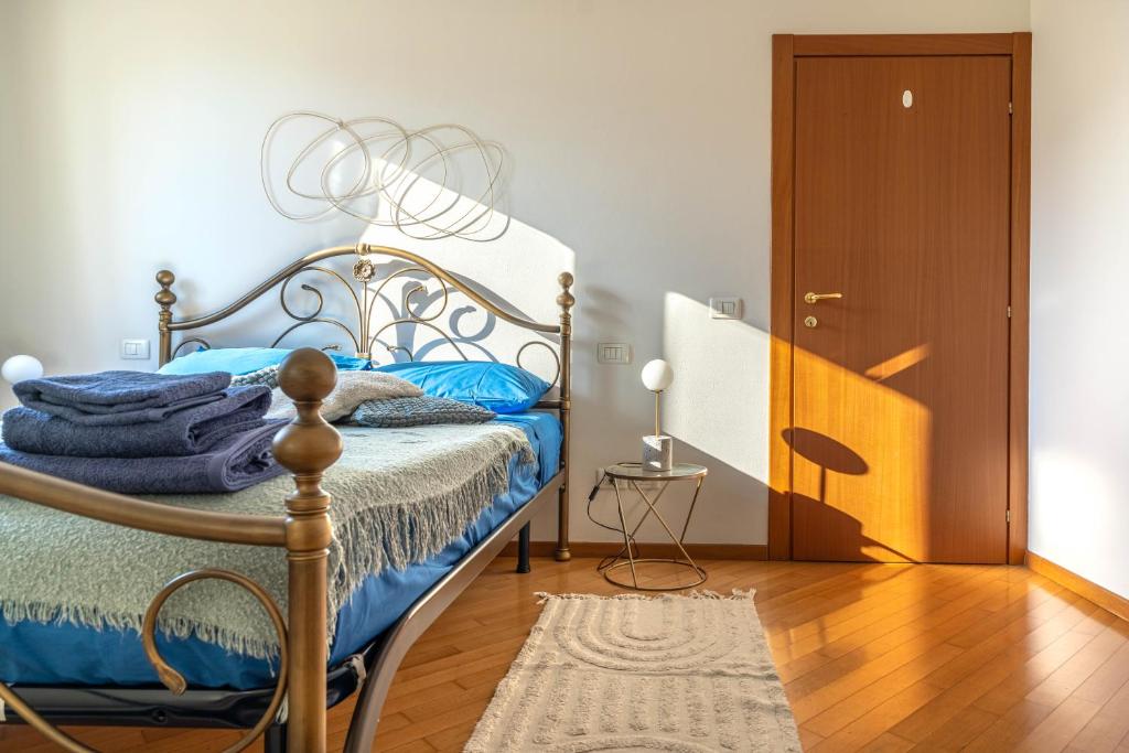 a bedroom with a bed and a wooden floor at FREE PARKING-HISTORICAL LUXURY PALACE- CITY VIEW-Free Wifi&Pet Friendly in Trento