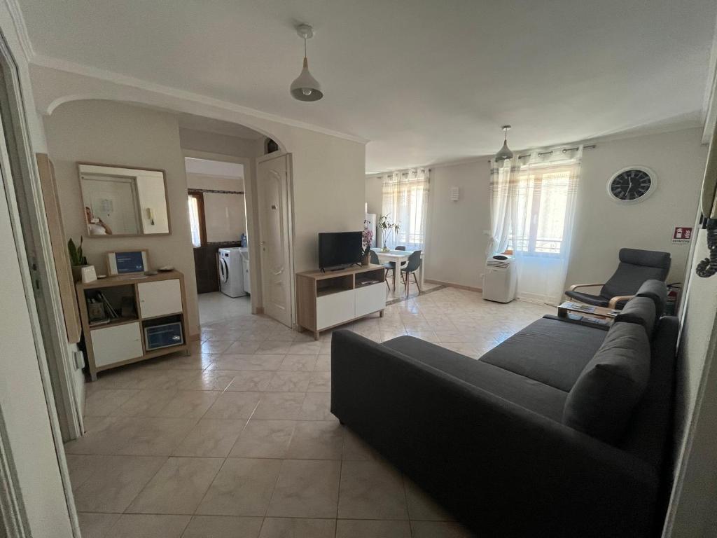 a living room with a couch and a table at Appartamento Cavour in Ventimiglia