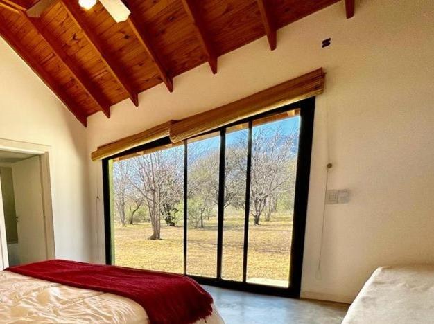 Ένα ή περισσότερα κρεβάτια σε δωμάτιο στο Complejo casa grande y dos lofts en Traslasierra