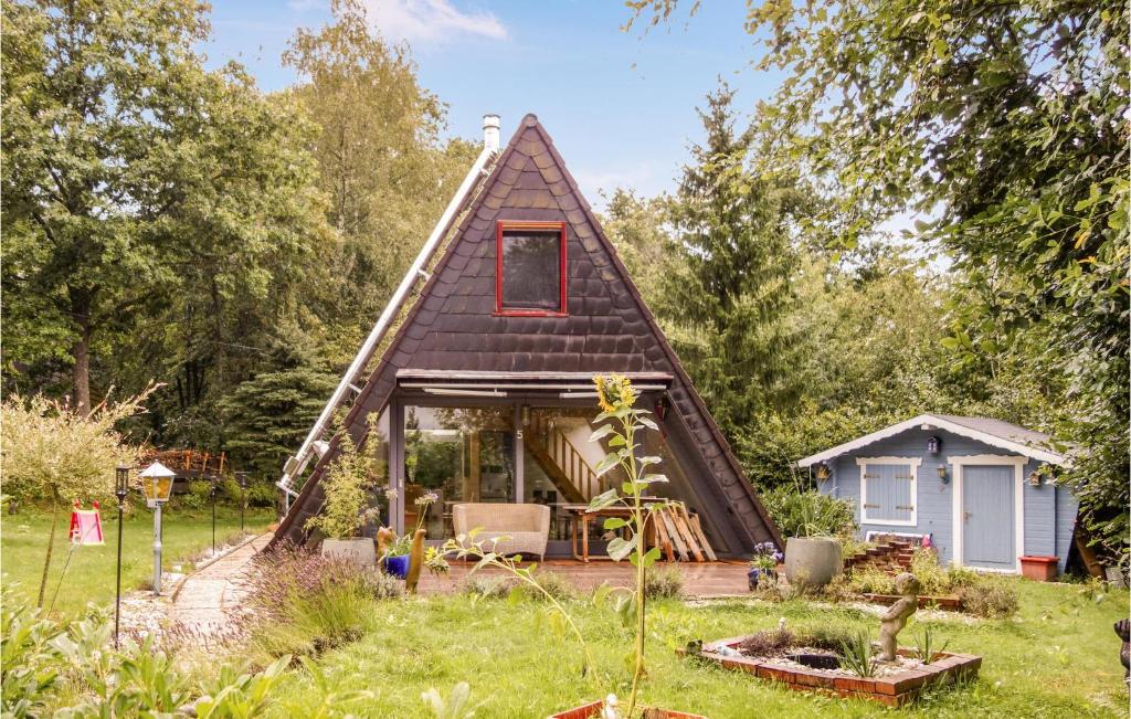 a small house with a thatched roof at Lovely Home In Kerschenbach With Wifi in Kerschenbach