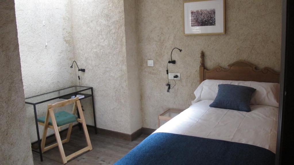 Postel nebo postele na pokoji v ubytování SueñoRural
