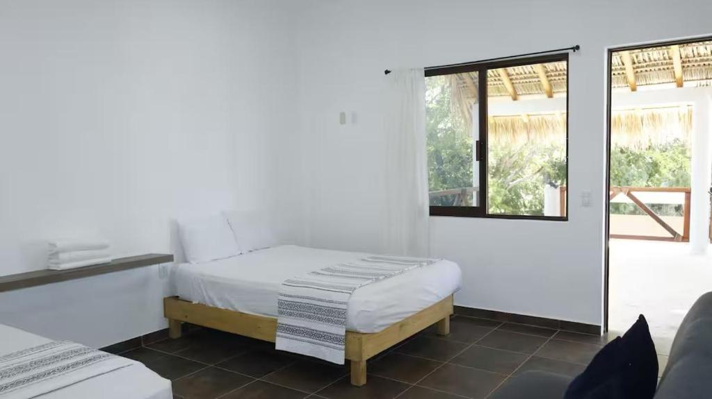 Ένα ή περισσότερα κρεβάτια σε δωμάτιο στο Villas de Ávila