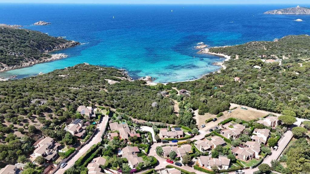 an aerial view of a beach with houses and the ocean at Holiday House Gioia in Chia