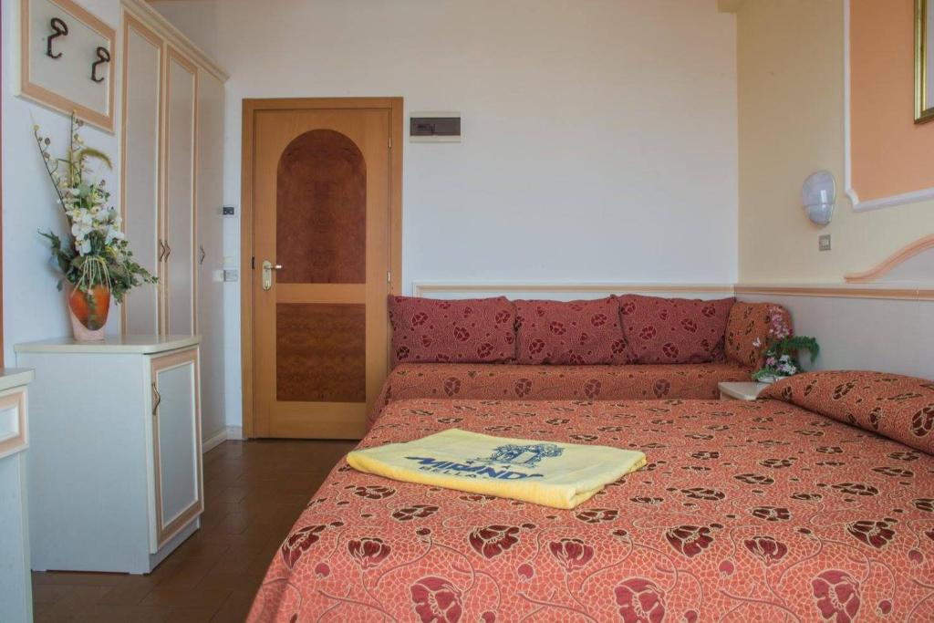 Postel nebo postele na pokoji v ubytování Hotel Miranda