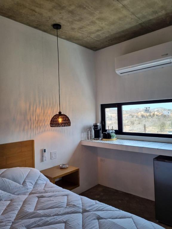 a bedroom with a bed and a window at Nest Aprt in San Carlos