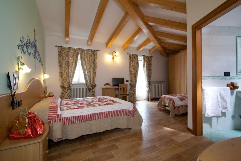 Postel nebo postele na pokoji v ubytování Hotel Sport