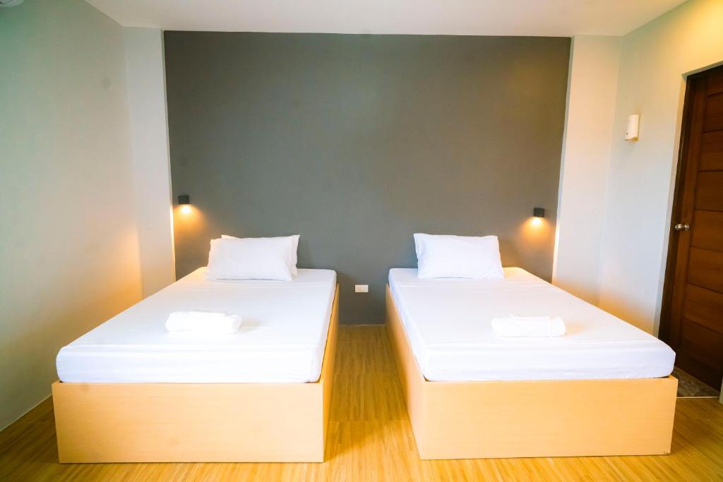 Ένα ή περισσότερα κρεβάτια σε δωμάτιο στο The Grounds Hotel