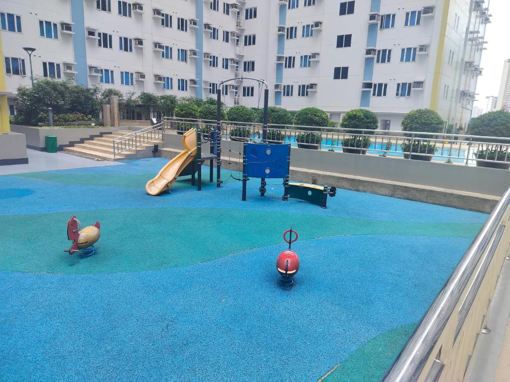 a playground with a slide at 7th Floor Tower B Studio Unit with Modern Amenities in Manila