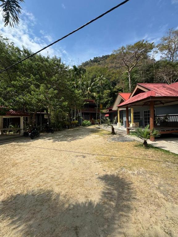 a large yard in front of a house at BESTUBA COTTAGE at PULAU TUBA, LANGKAWI in Pulau Selang Besar