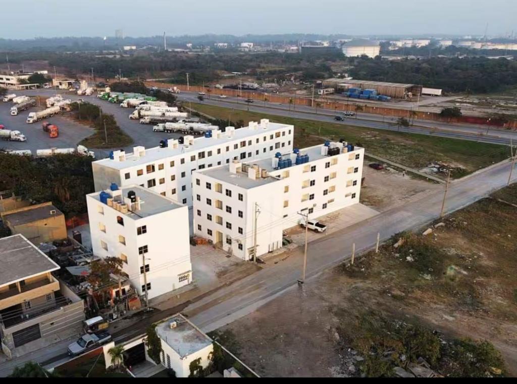 an aerial view of two white buildings and a street at Depto Vacacional Playa in Ciudad Madero