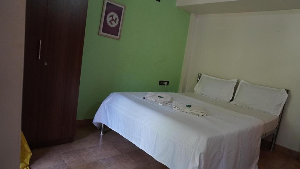 Ένα ή περισσότερα κρεβάτια σε δωμάτιο στο Hotel URA Inn