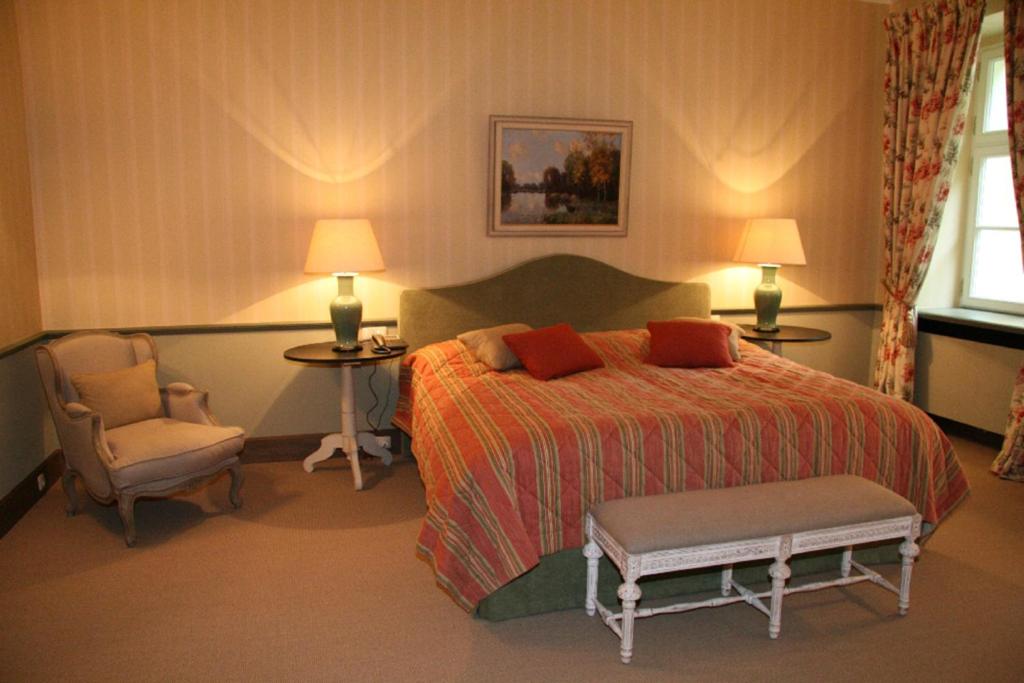 Postel nebo postele na pokoji v ubytování Hotel Château Bela
