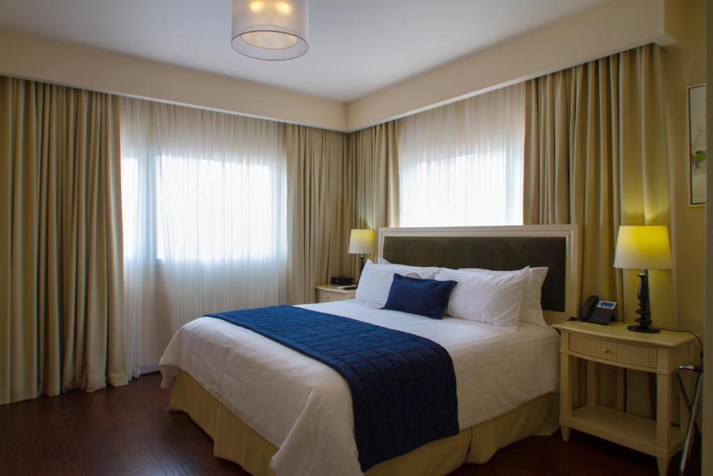 Postel nebo postele na pokoji v ubytování Isabella Boutique Hotel