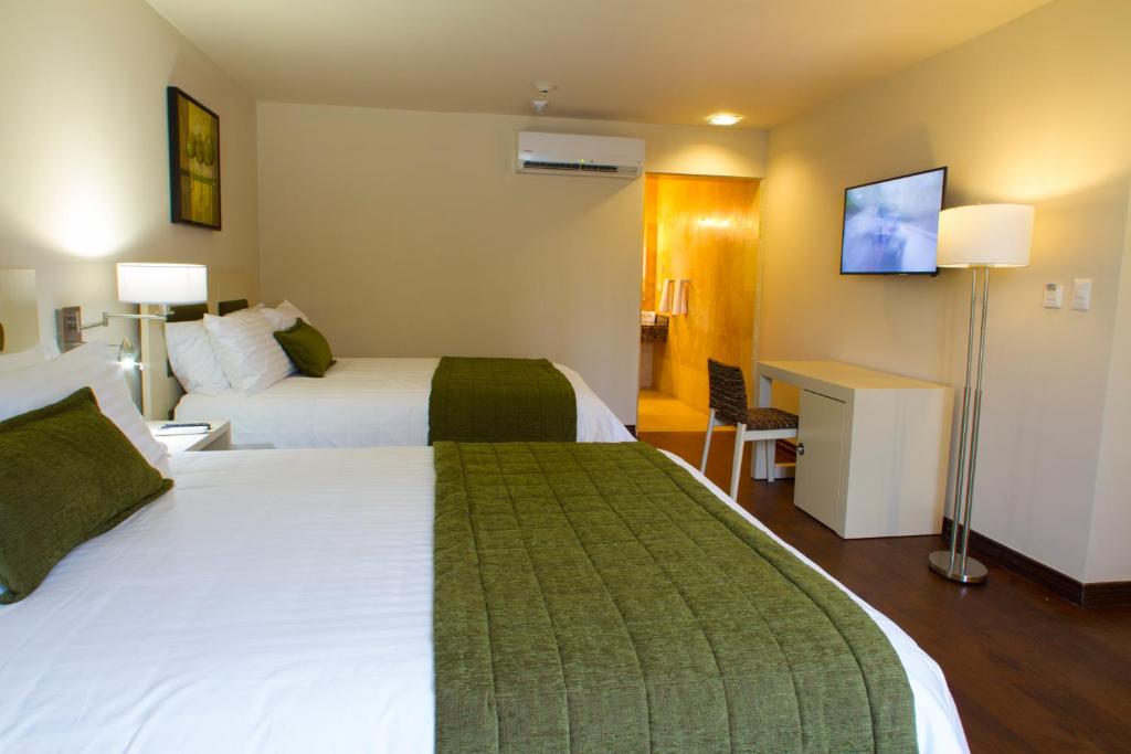 Postel nebo postele na pokoji v ubytování Isabella Boutique Hotel