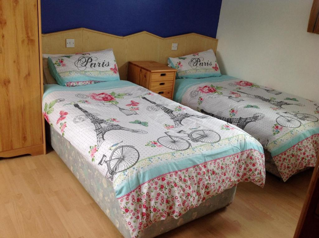 Postel nebo postele na pokoji v ubytování Divine Mercy B&B