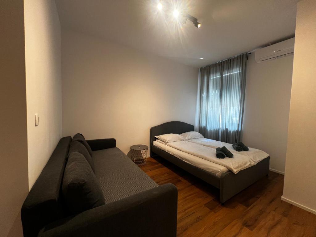 Ένα ή περισσότερα κρεβάτια σε δωμάτιο στο Ljubljana studios