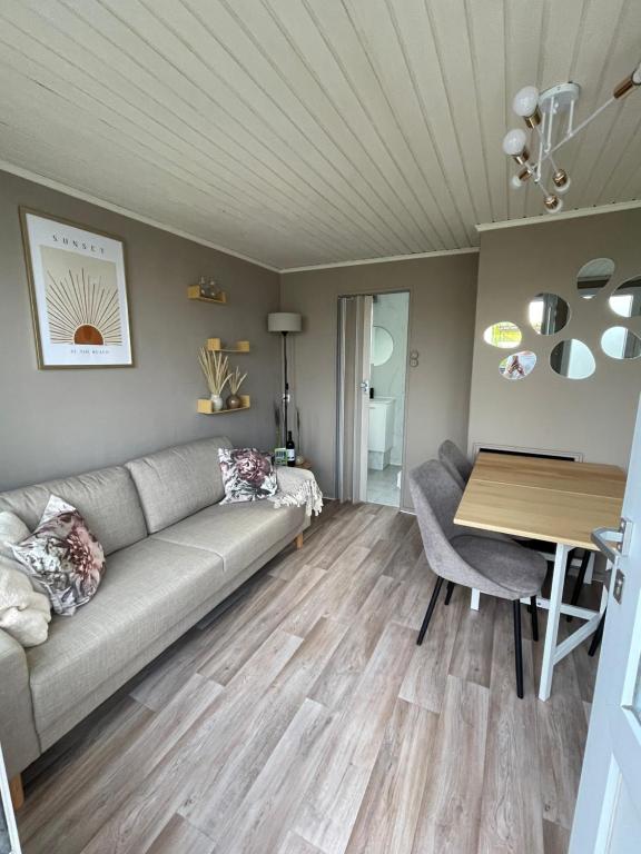 Гостиная зона в Vakantiehuisje Coester De Haan - 6 personen